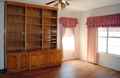 Secondary living room / flex space with custom built in shelving
