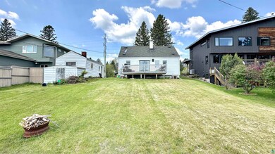 Rear view of house featuring a deck