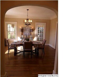 Formal Dining room with openings to foyer and brea