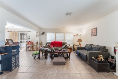 Living area featuring light tile patterned floors