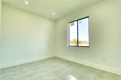 Unfurnished room featuring recessed lighting and l