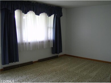 Living Room - Carpet, coat closet, triple window