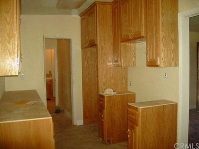 KITCHEN HAS NEW CABINETS AND TILE FLOOR