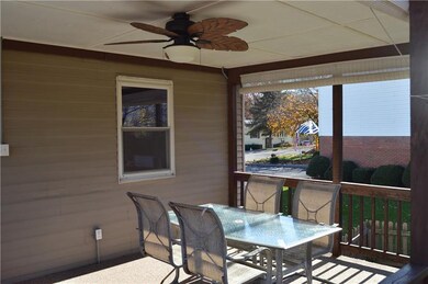 Covered deck with fan and privacy shades