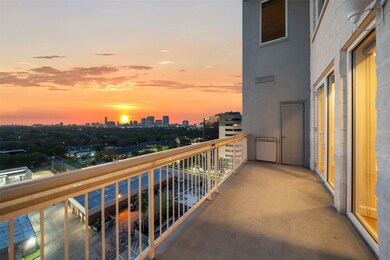 Experience breathtaking sunsets and cityscape views from this spacious balcony with storage closets on either end.