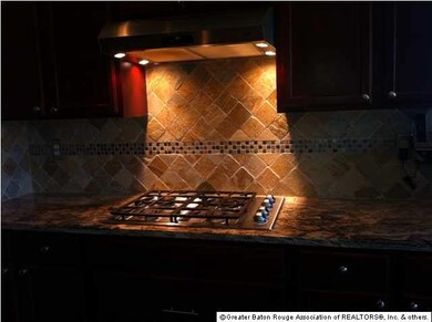 Granite countertops and tile backsplash