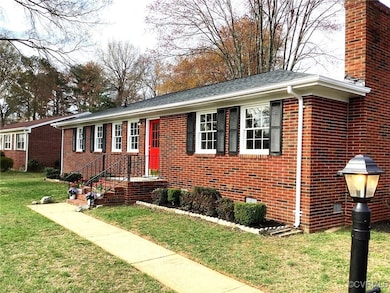View of front of property featuring brick siding a