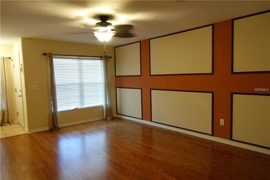 Spacious Living Room with laminate wood floors, de