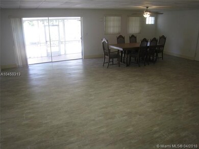 Great room with brand new wood-like tiled floors.