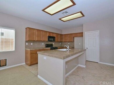 The kitchen features a center island and walk in p