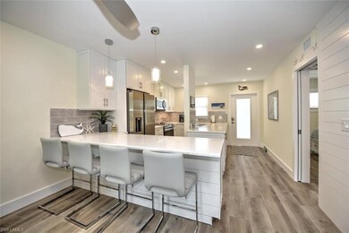 Kitchen with light countertops, stainless steel ap