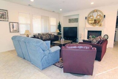 Large family room with entertainment center, fireplace, surround sound and recessed lighting