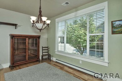 Large windows allow views out onto the HOA-maintai