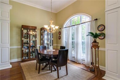Gorgeous Formal Dining room for holiday and special occasions.  Arched entry entry and window, decorative pillars, open to the Formal Living room