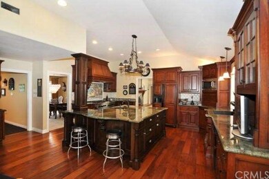 Gourmet kitchen with granite center island and sin