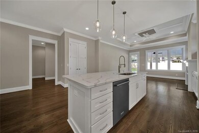 Large island opens up to the living room offering 