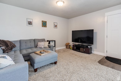 Living room with carpet and baseboards
