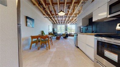 Kitchen with stainless steel appliances, white cab