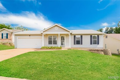 Ranch-style house with covered porch, concrete driveway, a front lawn, a garage, and a shingled roof