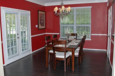 Formal dining room centered between kitchen and front porch.