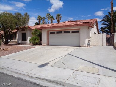 View of front of property featuring concrete drive