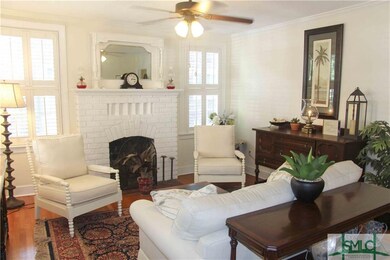 Large, bright living room with cozy fireplace.