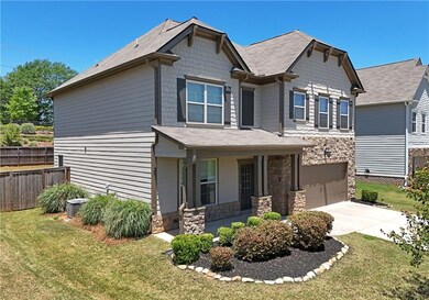 Covered front porch and nicely landscaped