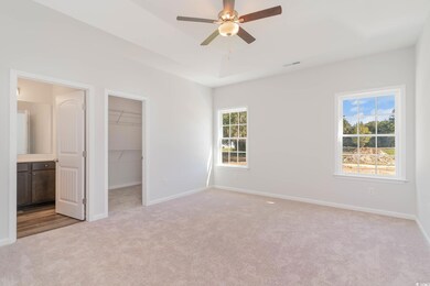 Unfurnished bedroom featuring a closet, ceiling fa