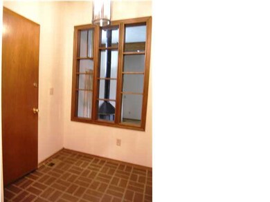 The entry foyer features vaulted ceiling, tile flo