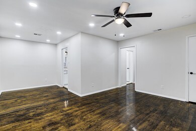Spare room with ceiling fan and dark hardwood / wo
