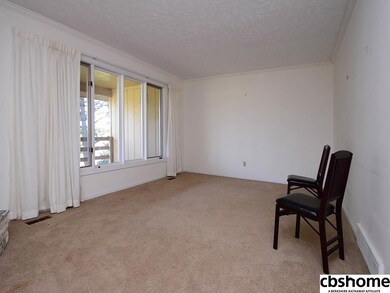 Marble Surround Fireplace. Room looks out to the large porch
