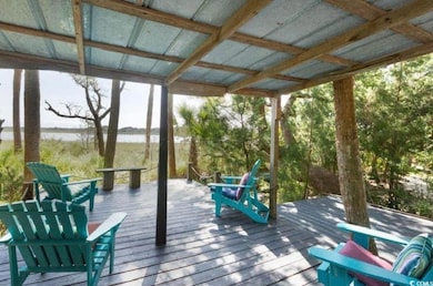 Wooden terrace featuring a water view