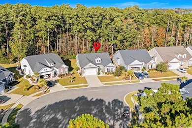 Aerial view of residential area featuring a heavily wooded area