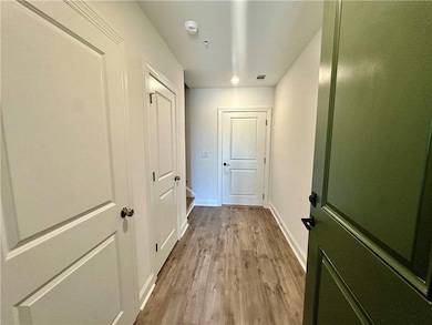 Guest Enter with laundry on the left next to coat closet with garage door directly ahead *Photos are from same floor plan but different home site*