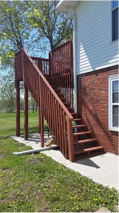 Sidewalk and stairs provide a rear entrance to uni