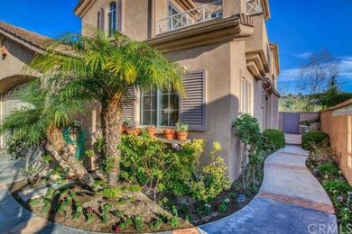 Pristine walkway with brick accents leading to fro