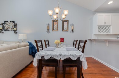 Dining room featuring light wood-type flooring, va