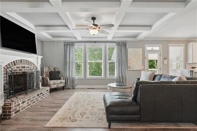 Living room with a brick fireplace, wood finished 