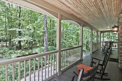 Large front porch is a relaxing space to enjoy nature