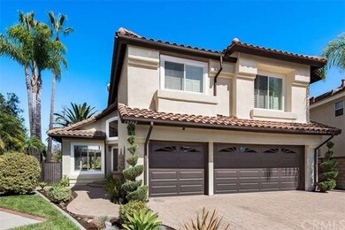 3 Car Garage with tastefully done Pavers around th