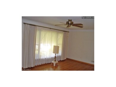 Another view of the living room. 4 ceiling fans th