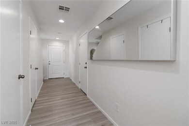 Corridor featuring recessed lighting and light woo