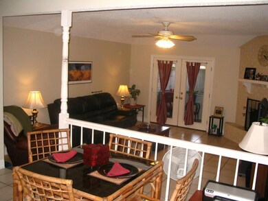 View of spacious den with raised hearth fireplace