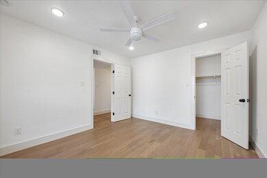 Unfurnished bedroom featuring light wood-style fl