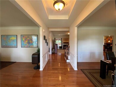 Foyer with office space to the left and dining roo