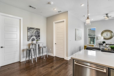 Kitchen with recessed lighting, dark wood finishe
