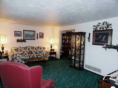 Living Room. Plastered walls throughout