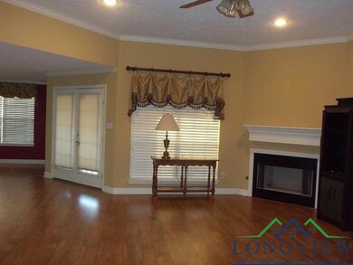 Unfurnished living room featuring hardwood / wood-