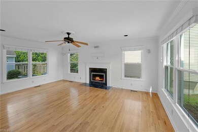 Living area with wood burning fireplace.
