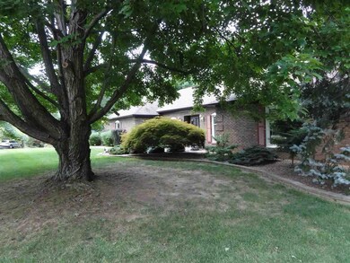 The beautiful tree in the front yard is a focal po
